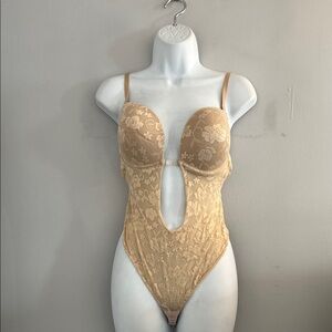 Backless bodysuit with bra 
Size 38- XL